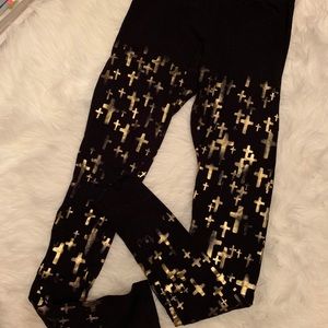 Black leggings with gold cross pattern pants